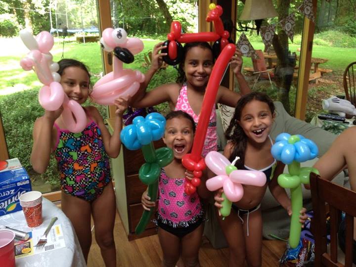 My nieces with a bevy of twisted balloon animals and arrangements by Twister Vic